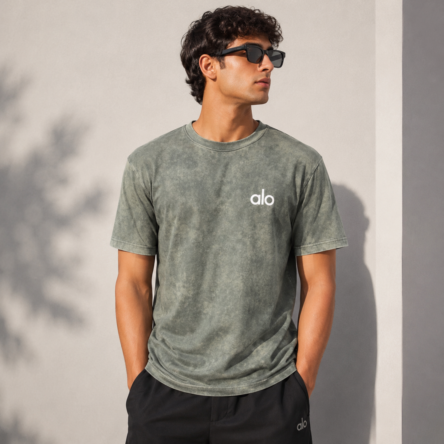 Alo brand washed T-shirt worn by male model